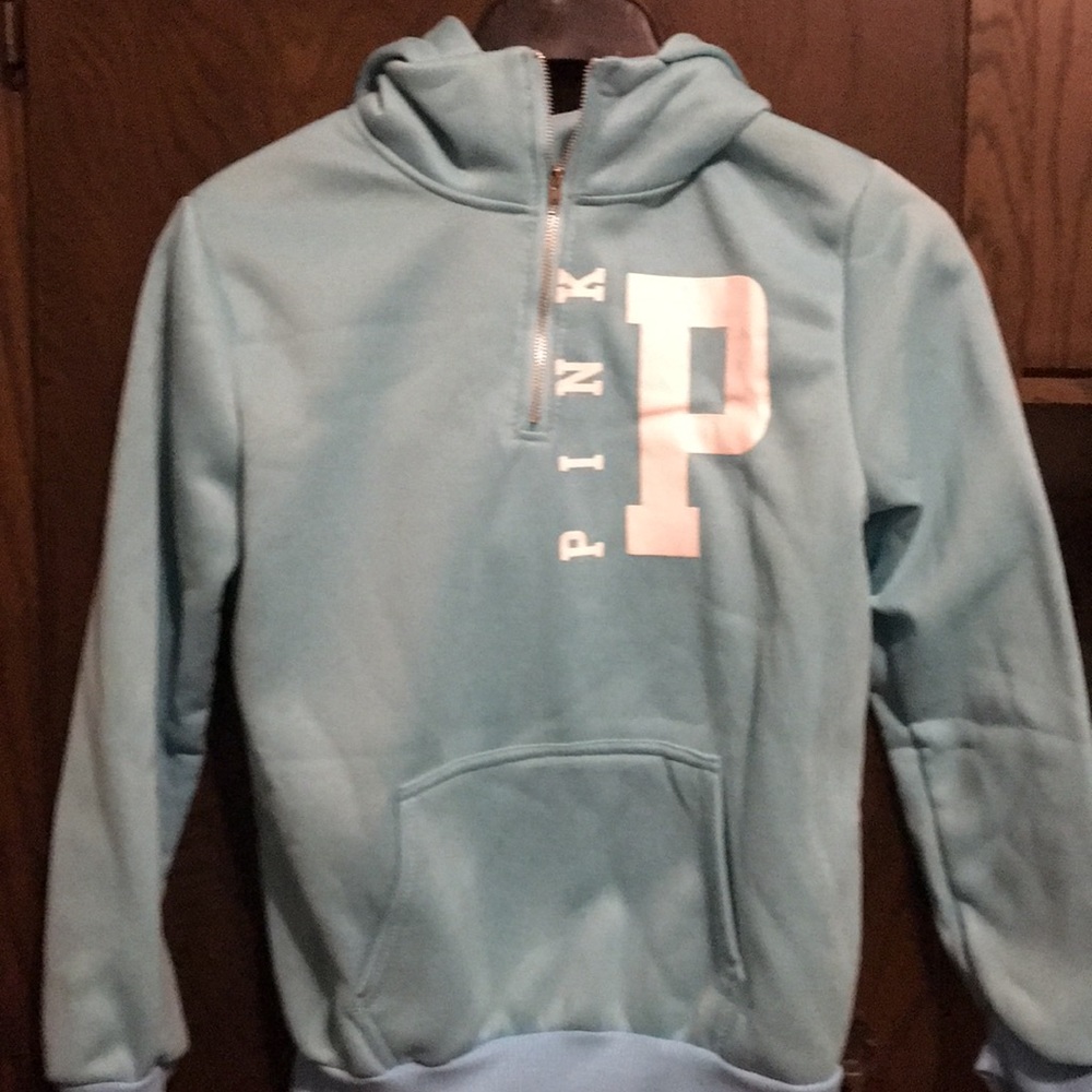 Never worn...Light blue 3/4 zip up hoodie.
